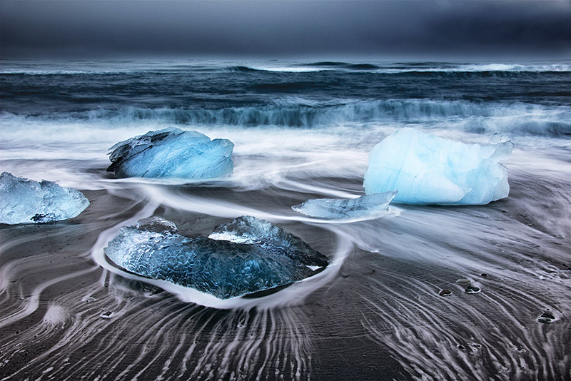 Beautiful immage of glacier rocks in black sand